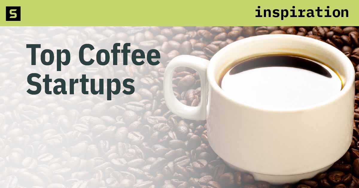 Coffee beans and cup of coffee on wooden table.